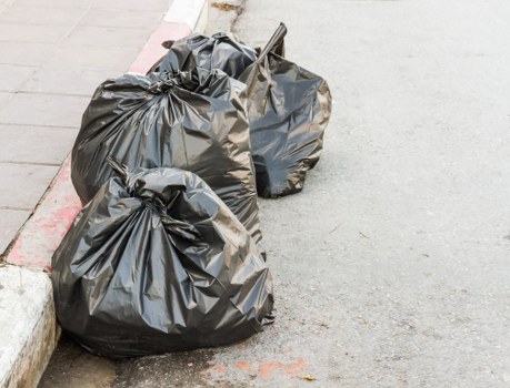 Construction workers managing waste clearance in Holborn